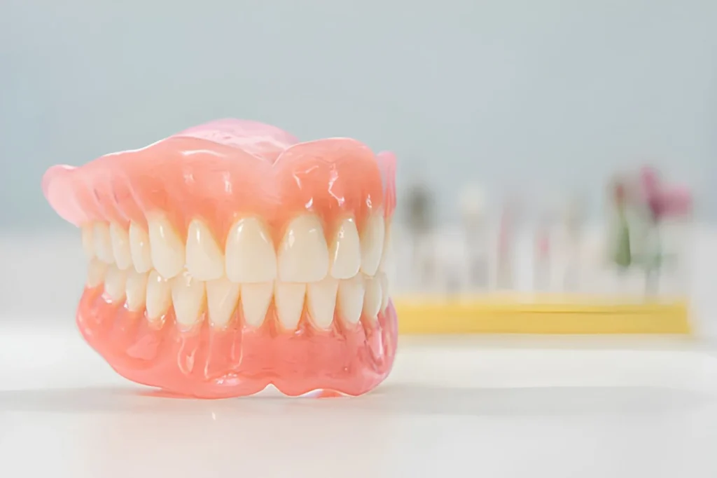 Full removable dentures used to replace missing upper and lower teeth